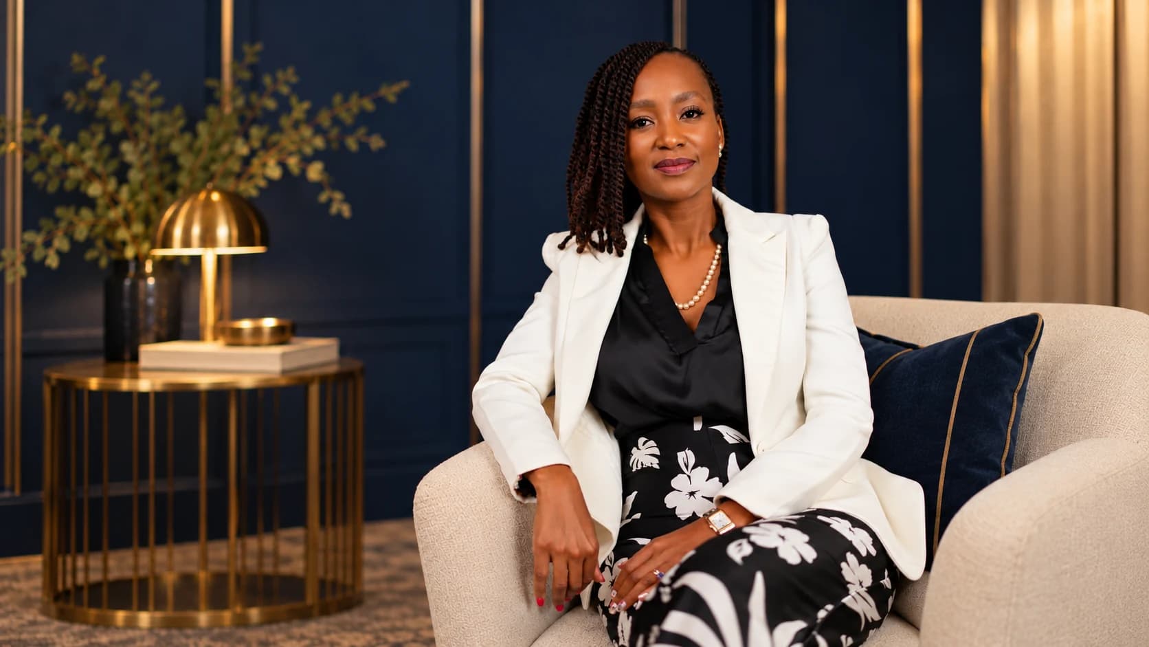 Tebo Shabangu seated in a navy office